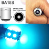 Close-up view of a BA15S single contact bayonet light bulb and an illuminated LED bulb.