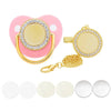 A pink pacifier with a gold clip and rhinestone decoration is shown next to several white pacifiers.