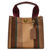 A brown canvas crossbody tote bag with vertical stripes and a maroon strap.