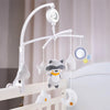 A white musical crib mobile featuring a rotating rattle bracket with soft, cloud-shaped animal charms hanging from it.