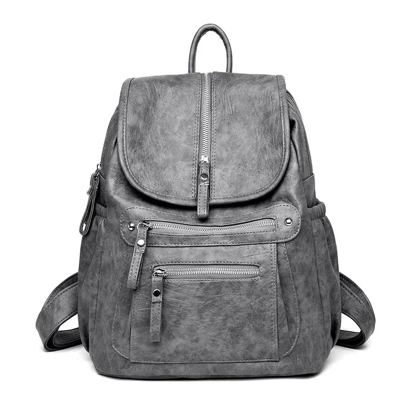 A gray vintage faux leather women's backpack with multiple compartments.