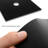 A hand is holding a black PTFE coated fiberglass fabric mat with a star-shaped hole.