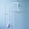 A white musical crib mobile with a rotating rattle bracket shown against a light blue background.