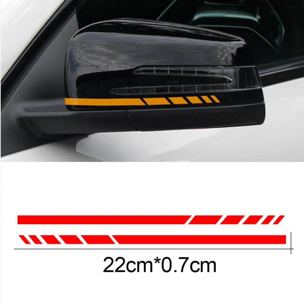 Black reflective vinyl mirror decal applied to a car's exterior panel.