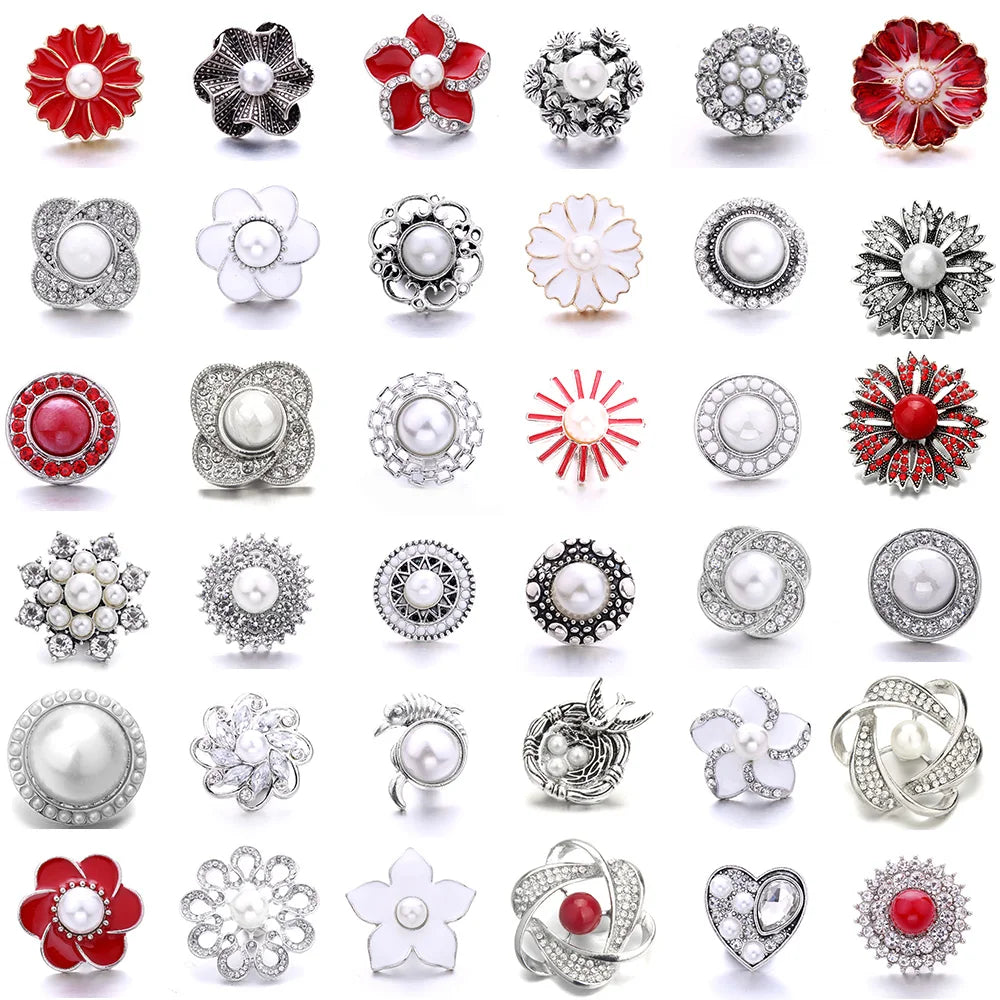 A collection of various 18mm metal snap buttons and decorative findings for jewelry making.