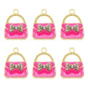 Set of six crystal enamel handbag charm pendants in pink and gold.