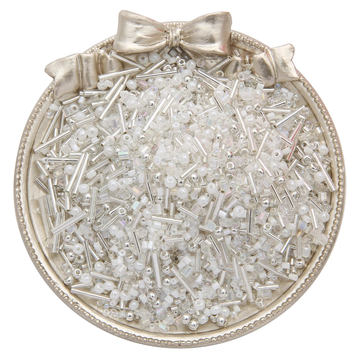 A circular dish filled with mixed clear and white glass seed beads tied with a bow.