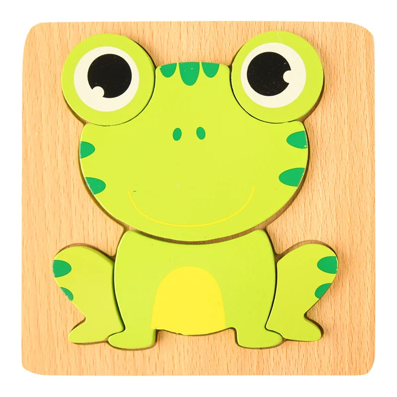 A wooden 3D frog puzzle set featuring a bright green frog with large eyes and yellow belly.