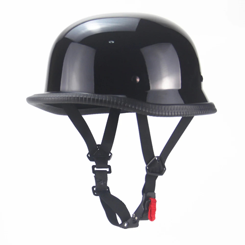 Matte black vintage German half-face motorcycle helmet with a textured visor and black straps