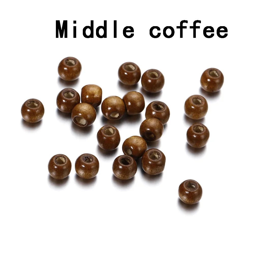 A collection of brown natural wooden spacer beads scattered on a white background.