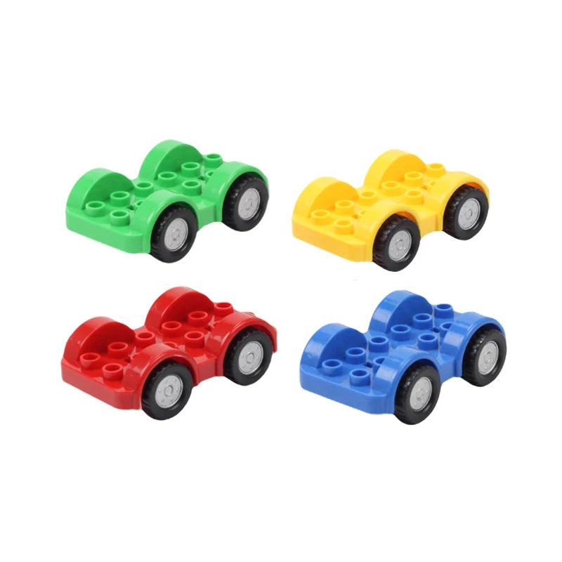Three brightly colored plastic toy cars built from interlocking building blocks in green, yellow, and blue.
