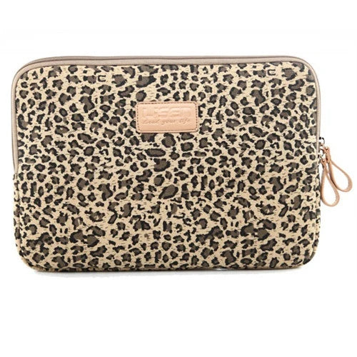 A beige and brown leopard print durable canvas laptop sleeve for a MacBook.