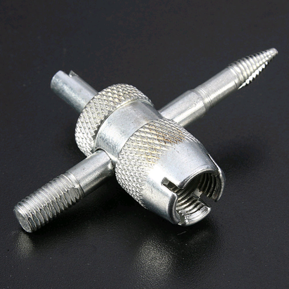 Jeu d'outils de réparation de valve de pneu argenté à 4 voies avec pointes filetées et corps hexagonal.
