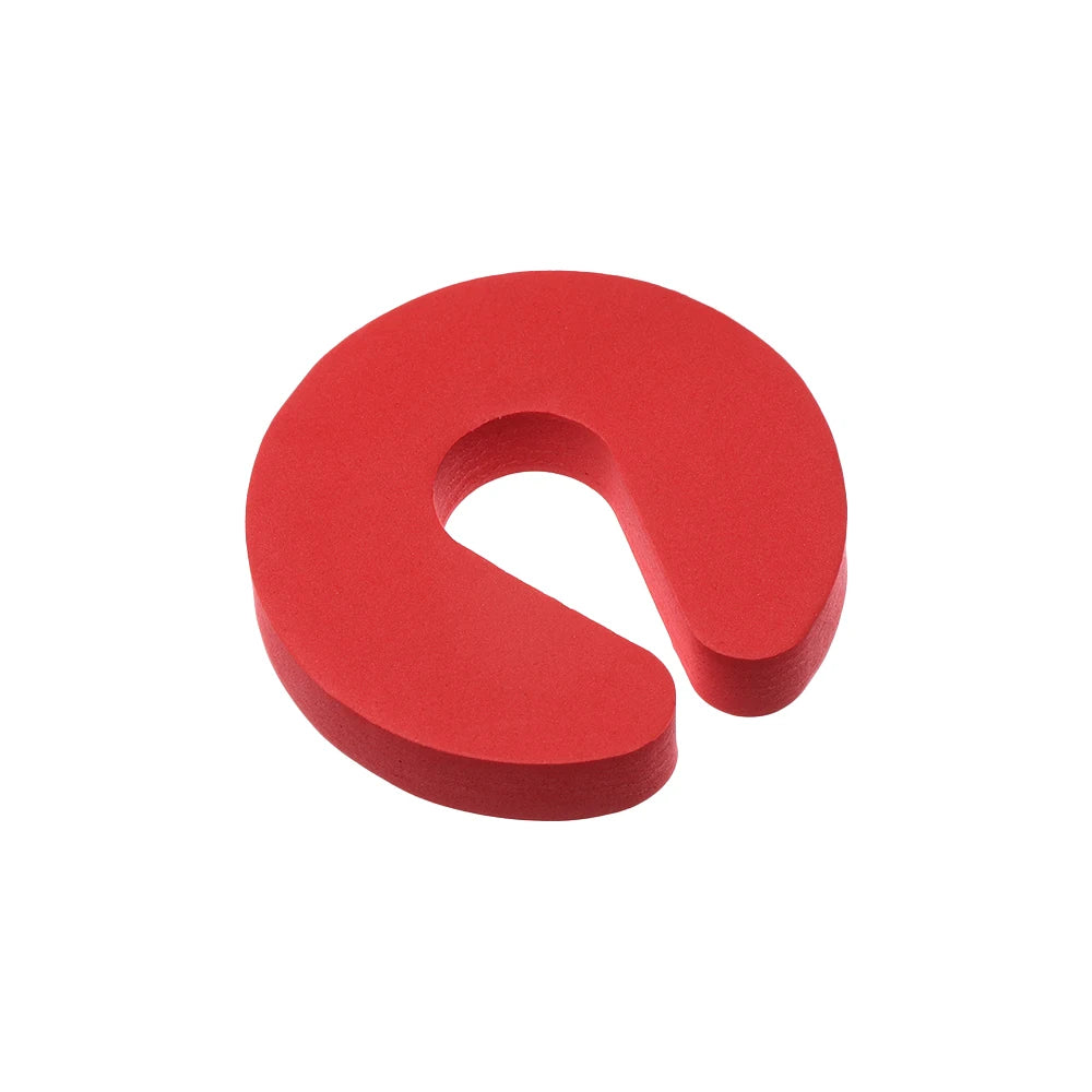 A red foam door stopper with a finger pinch protection design.