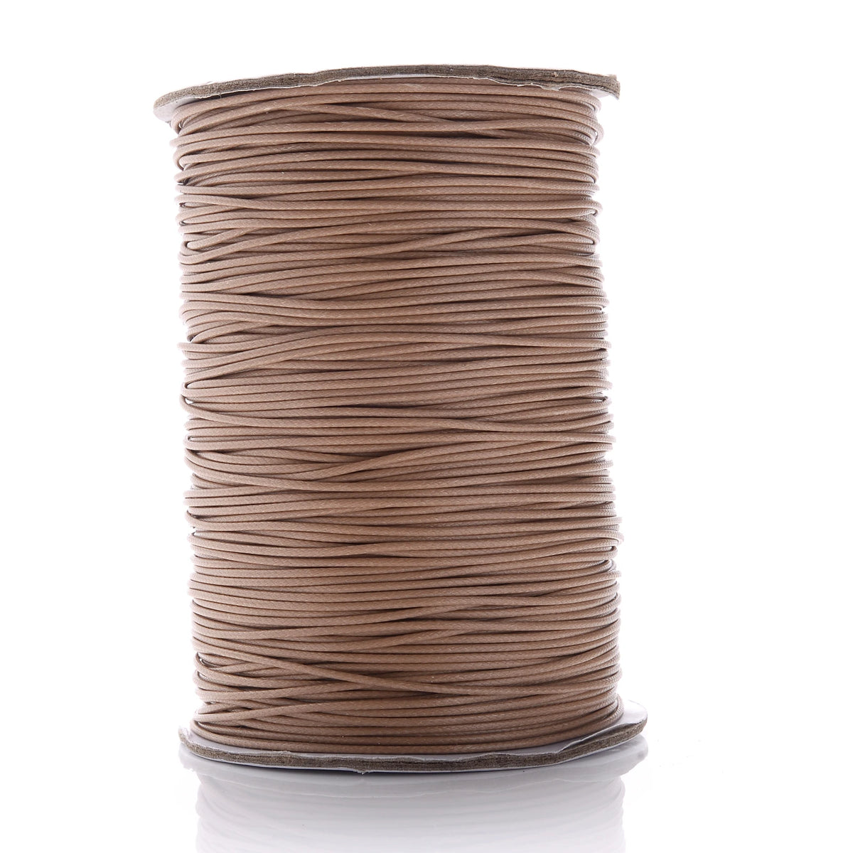 A spool of brown waxed cotton cord used for jewelry making