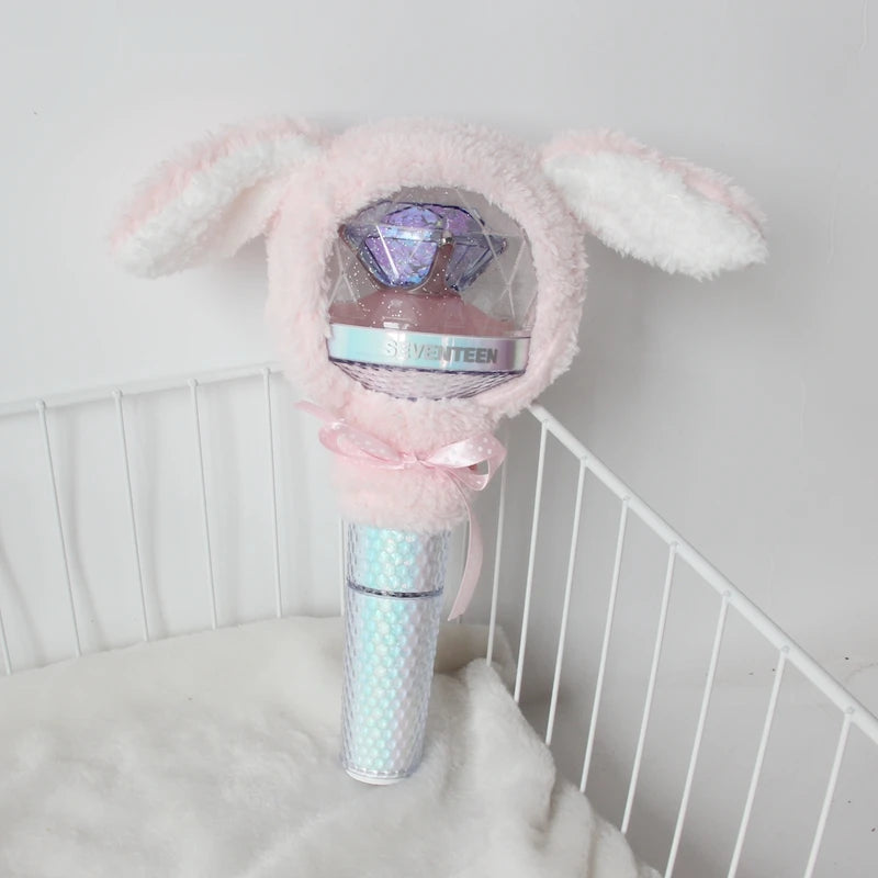 A pink plush cover shaped like an elephant head for a SEVENTEEN official light stick.