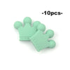 A set of ten light green silicone crown beads for jewelry making and DIY crafts.