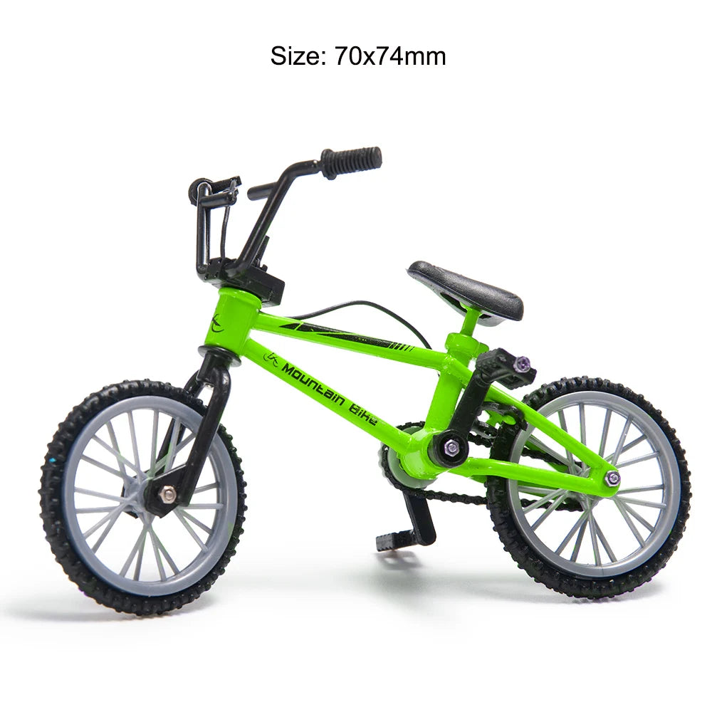 A bright lime green 1/10 scale RC crawler decoration set featuring a bike, shovel, fire extinguisher, and oil drum.