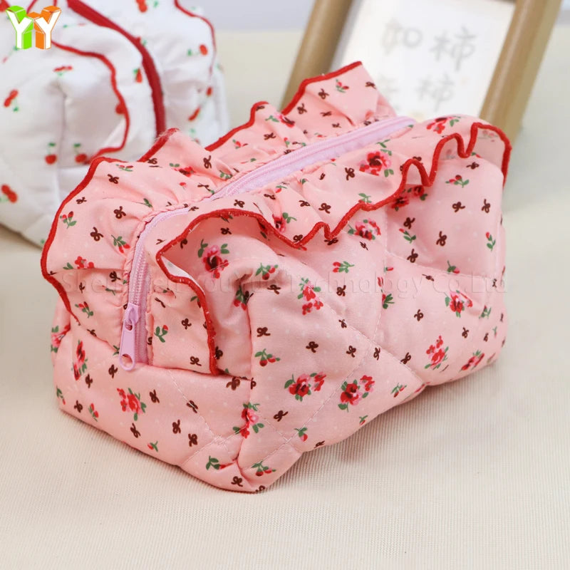 Neceser acolchado con estampado floral y lazo decorativo