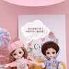 Two poseable fashion dolls with pink and blue hair and clothing displayed against a light pink background.