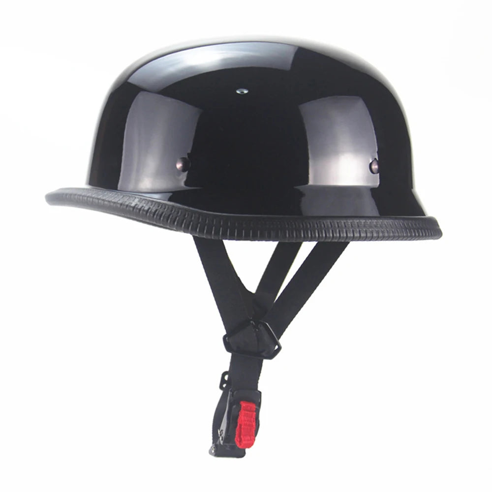 Matte black vintage German half-face motorcycle helmet with a visor and chin strap