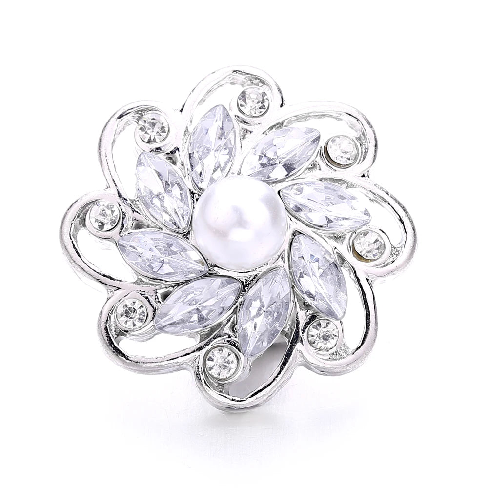 Silver metal snap buttons for jewelry making featuring a floral design with clear stones and a central pearl.