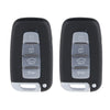 A pair of black keyless entry systems with silver buttons and a small silver strip.