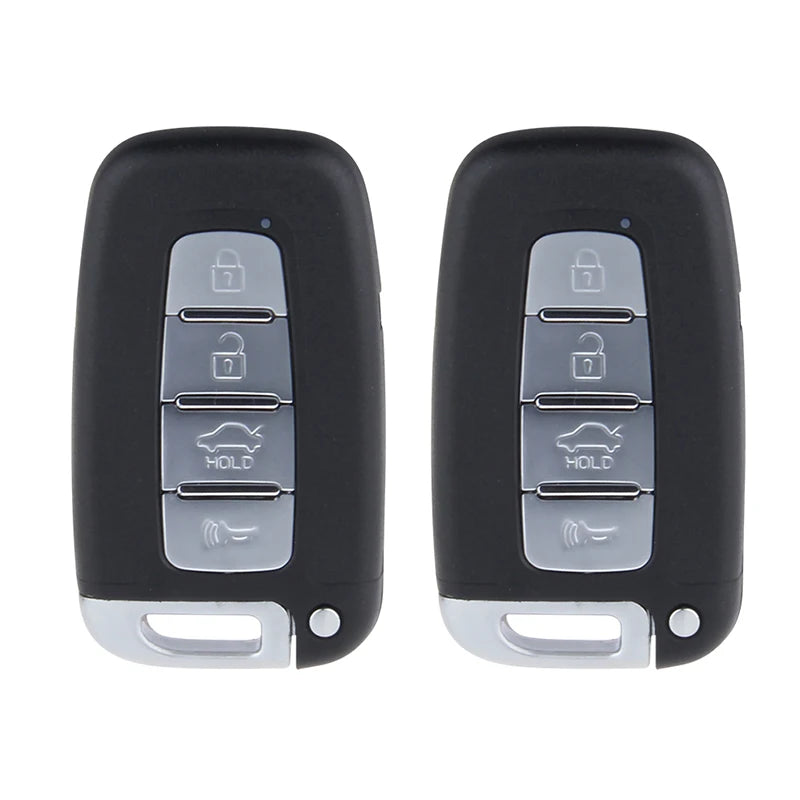 A pair of black keyless entry systems with silver buttons and a small silver strip.