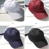 Four views of a classic cotton dad hat in white, maroon, navy blue, and black colors.