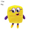 A yellow plush doll shaped like the number 1, featuring purple glasses and a smiling face.