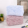 A pair of cosmetic bags featuring leopard print fabric with plush blue and pink linings.