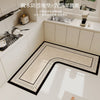 An L-shaped crystal velvet kitchen mat with a black non-slip backing placed on a white kitchen countertop.
