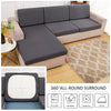 A gray sofa cushion cover displayed on a beige sofa, with icons showing washing instructions.