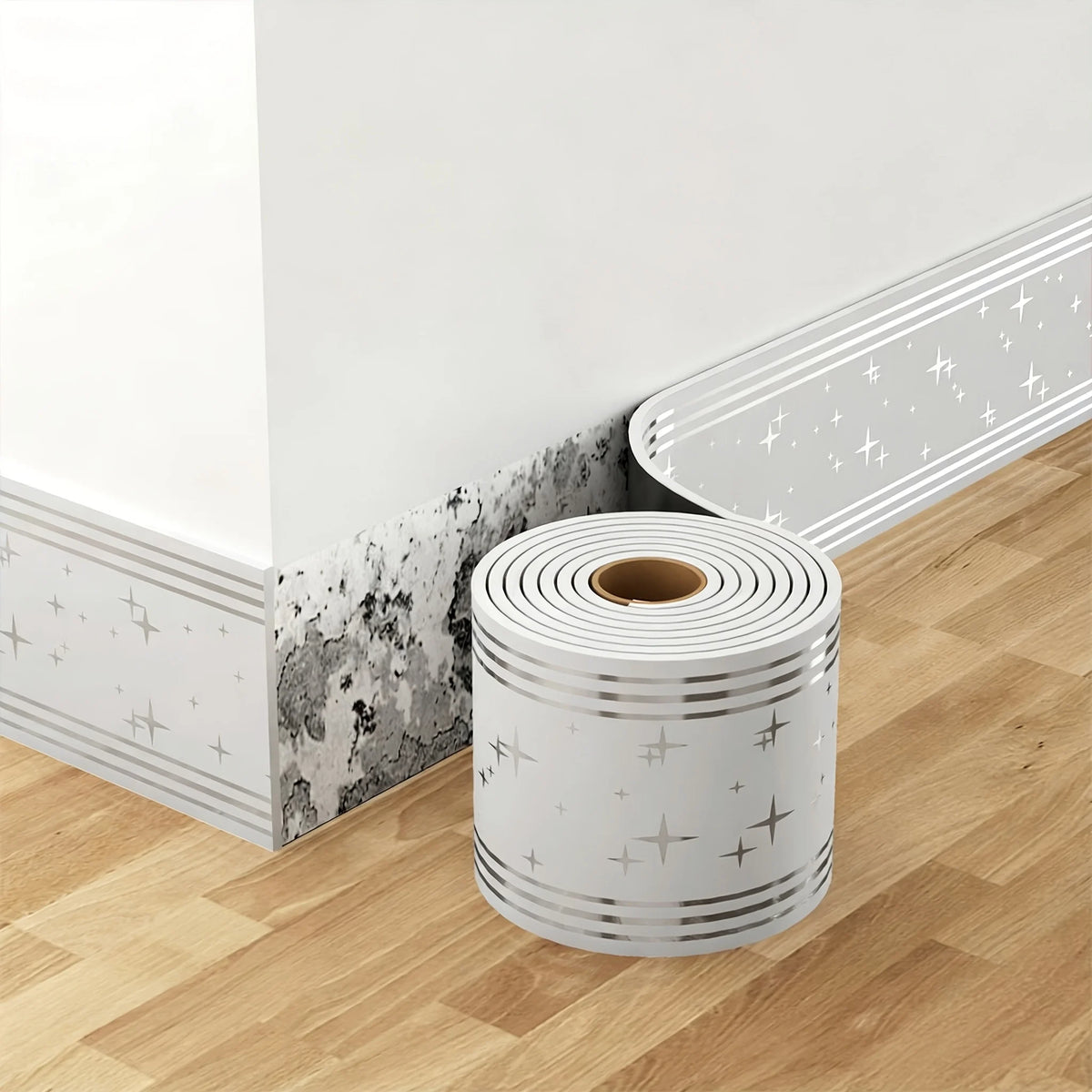 Roll of white self-adhesive PVC trim for baseboards and door frames placed on a wooden floor.