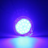 A bright LED puddle light is shown illuminating a purple surface against a dark blue background.