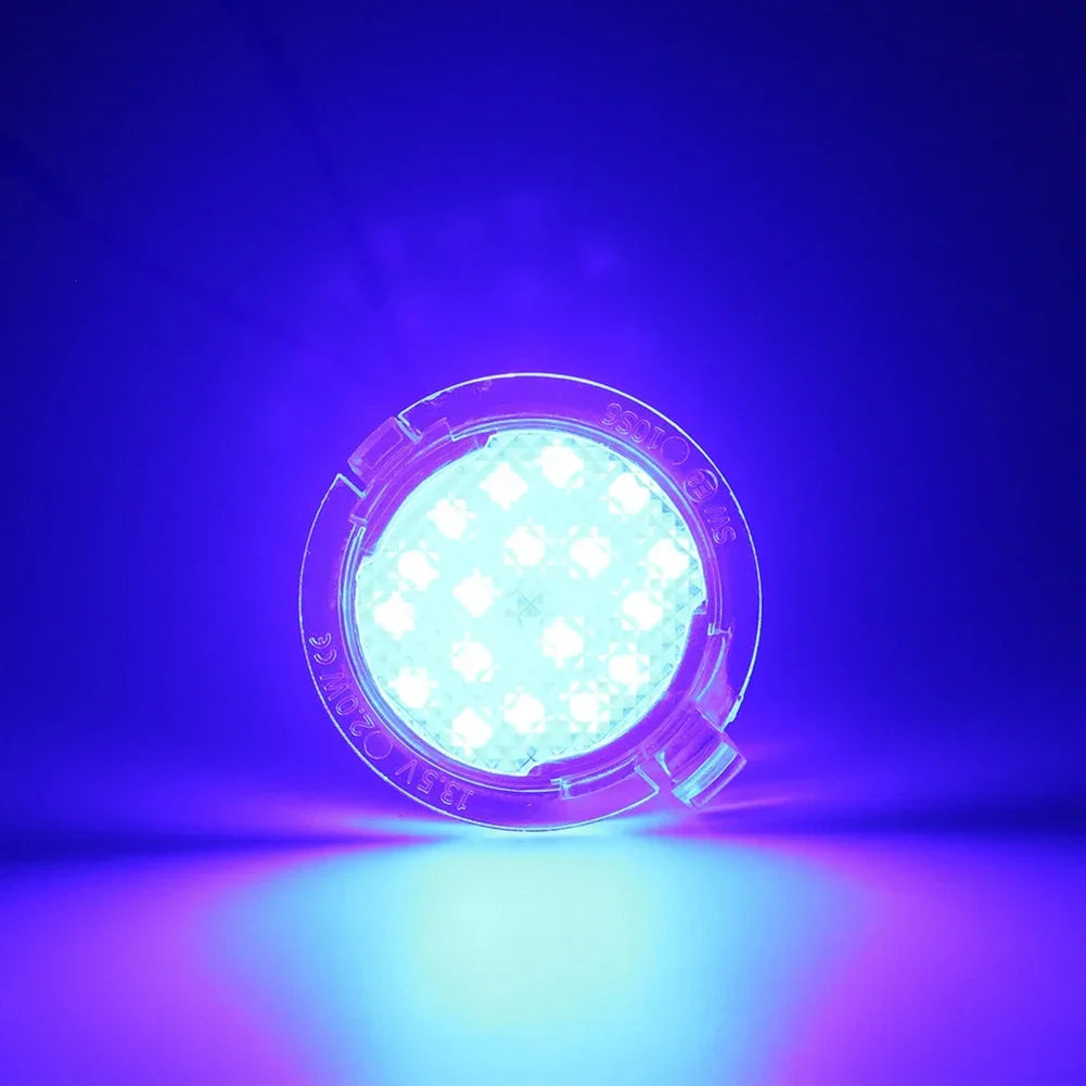 A bright LED puddle light is shown illuminating a purple surface against a dark blue background.