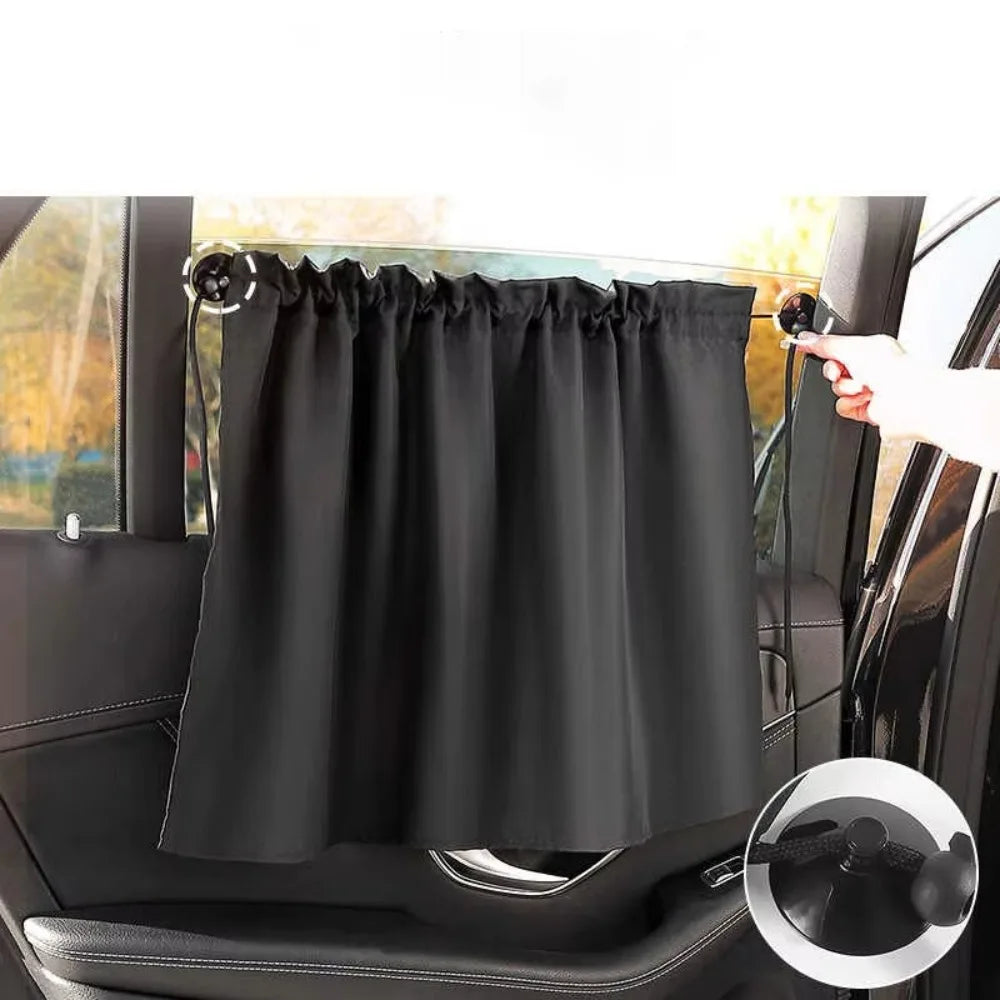 Black universal car side window sunshade installed on a vehicle window.
