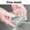 A hand is holding a fine mesh disposable sink strainer bag, demonstrating its delicate texture.