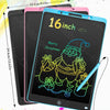 A pink and blue LCD writing tablet is shown with a stylus pen, displaying a Christmas greeting.