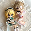 A pair of articulated BJD collectible figurines featuring light blonde hair and pink accents in a blind box style.