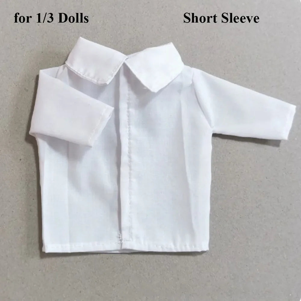 A white short sleeve shirt for a fashion doll, labeled for 1/3 Dolls.