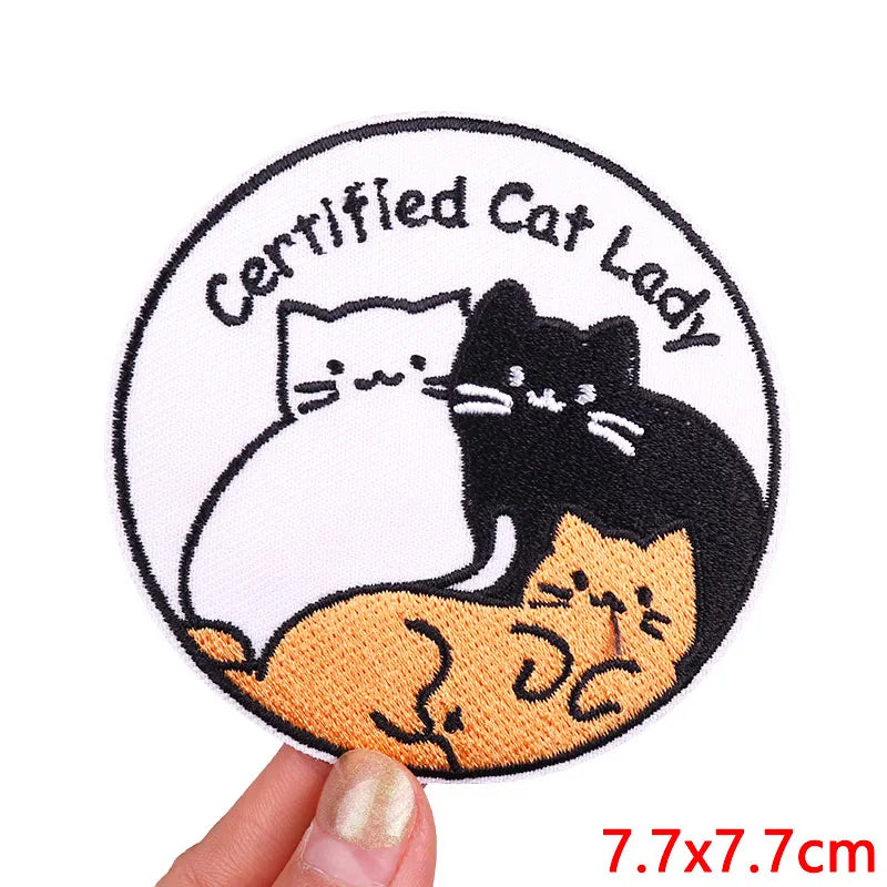 Embroidered patch featuring a black cat sitting on an orange cat inside a circle with the text Certified Cat Lady