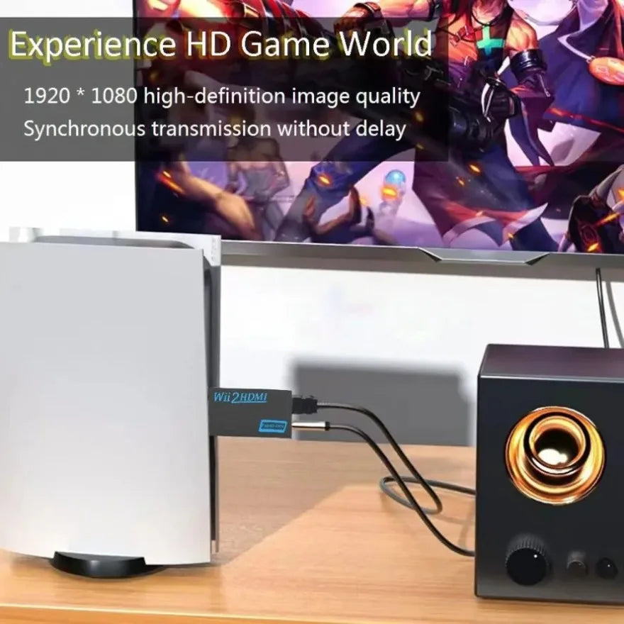 A white Wii to HDMI adapter converter device is shown next to a black audio device on a wooden table.