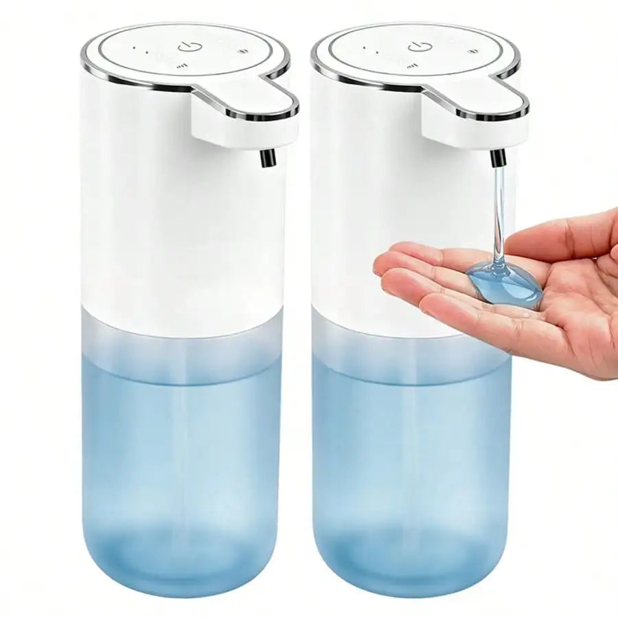 A clear blue automatic soap dispenser with a white pump top is held in a hand.