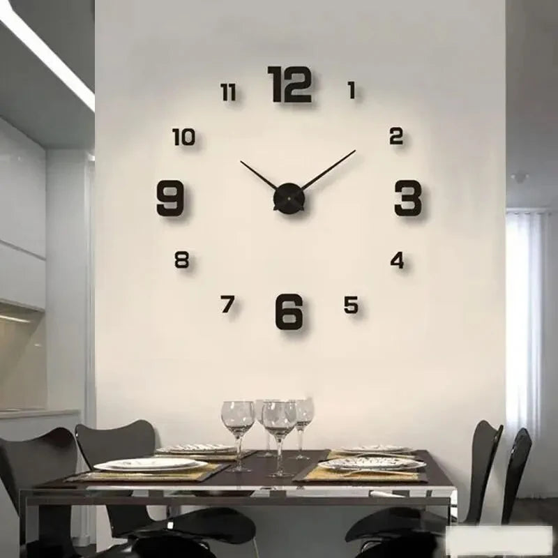 A modern wall clock with black numbers and hands is mounted on a white wall above a glass table.