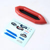 A red plastic RC car decorative accessory set featuring surfboard, kayak, and roadblock pieces.
