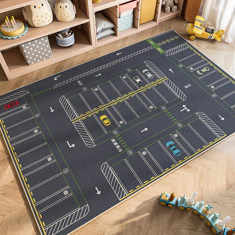 A dark gray play mat depicting a cartoon car traffic layout for kids in a nursery or playroom.