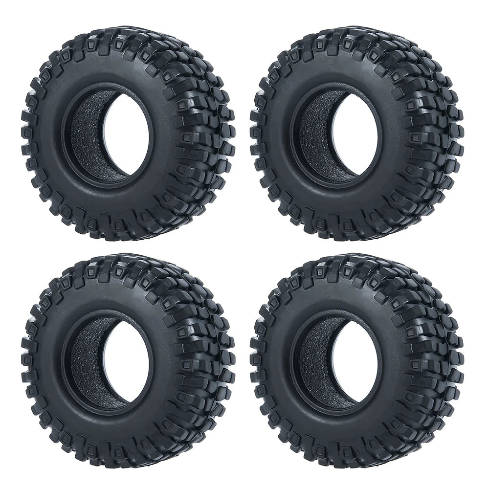 Four black soft rubber tires for 1/18 and 1/24 RC crawler cars shown from the top.
