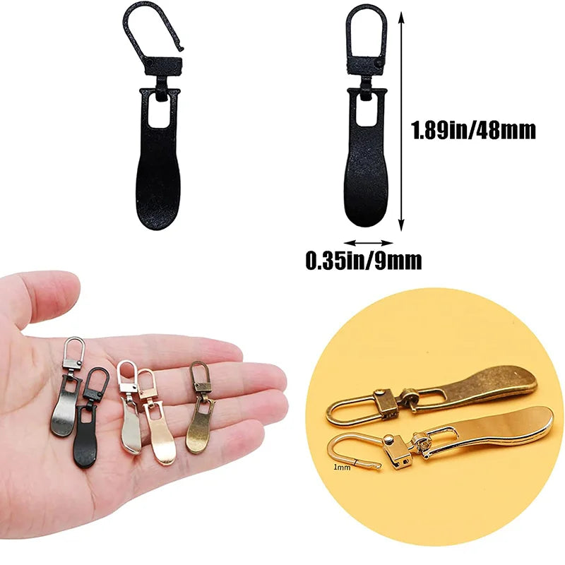 A set of durable metal zipper pull replacement sliders in black and gold colors shown on a hand.
