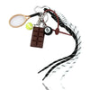 A metal keychain featuring an 8-ball charm, a chocolate bar charm, and a tennis racket, all with a sleek black finish.